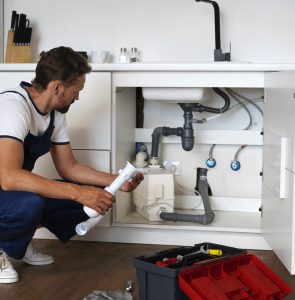 plumbing-professional-doing-his-job plumbing-professional-doing-his-job